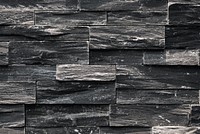 Close up of a black uneven wall