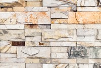 Beige brick wall textured wallpaper vector