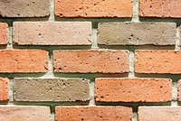 Orange brick wall textured wallpaper vector