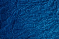 Crumpled  blue paper textured background
