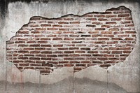 Grunge bricks on a cracked concrete wall textured background