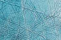Paled blue leather textured background