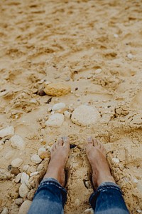 Bare feet on the beach in Portugal