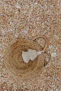 Handmade beach bag left in the sand