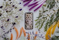 Phone mockup framed with a bunch of dried colorful flowers