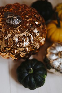 Golden metallic pumpkin on the table