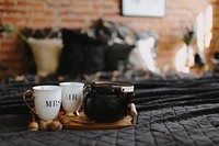 Tea set serving on a black linen bed