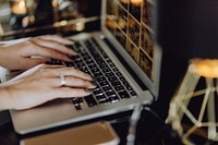 Woman working on her blog in a laptop