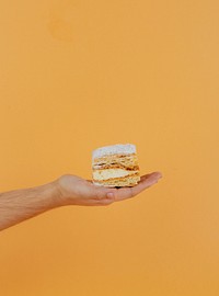 Freshly bake custard cake on a hand