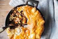 Close up of a meat pie in a pan