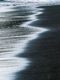 Wave on the sand of the Galápagos Islands, Ecuador