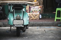 Old scooter parked on a street