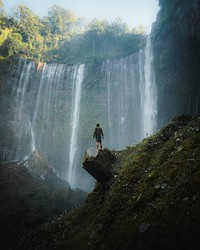 Man standing by Tumpak Sewu Waterfalls, Indonesia