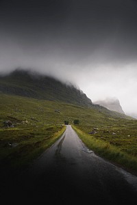 Scenic route leading to a misty mountain