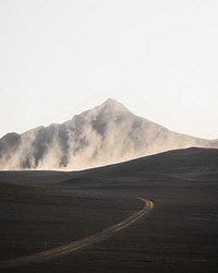 Curve road with a misty volcanic drone shot