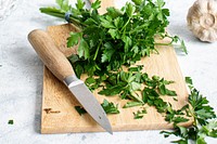 Fresh organic parsley on a wooden cutting board