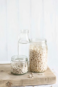 Raw organic white beans in containers
