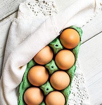 Chicken eggs in a green tray