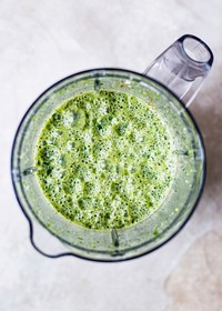 Fresh green smoothie in a blender