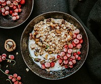 Granola served with soy milk and red currants