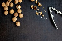 Dried walnuts and a nut cracker