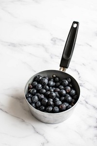 Fresh blueberries for blueberry cheesecake in a saucepan