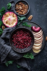 Closeup of fresh pomegranate with sliced apple food photography