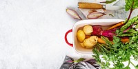 Fresh organic vegetables in a white bowl aerial view