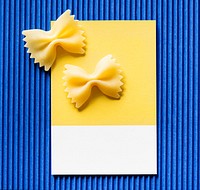 Farfalle pasta on a yellow card