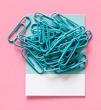 Paperclips on a piece of paper