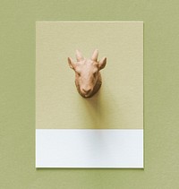 Colorful goat figure on a paper