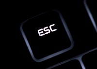 Closeup of ESC button on black keyboard