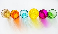 Colorful glasses on white background