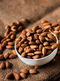 Roasted almonds in a white bowl