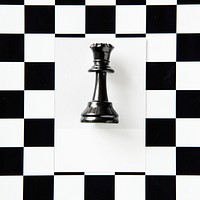 Queen chess piece on a pattern