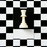 Queen chess piece on a pattern