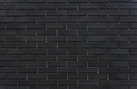 Black brick wall textured background