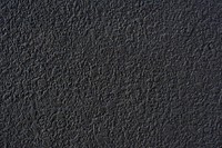 Rough black cement plastered wall texture