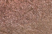 Crumpled copper metallic paper textured background