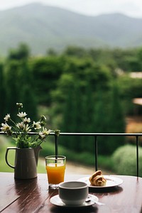 Breakfast on a wooden table with a natural view