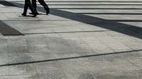 Two people walking on the street