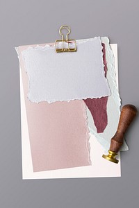 Blank torn pink paper templates set with a paperclip