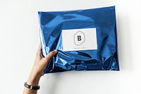 Woman holding up a package mockup