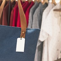 Blank tag on a tote bag in a store