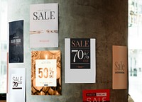 Different sale posters on a wall