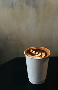 Cup of coffee with a creative latte foam