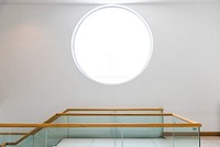 Round window on a white wall