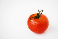 Macro shot of fresh tomato isolated on white background
