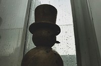Silhouette of a snowman on a rainy day