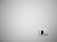 Light switch on a white wall